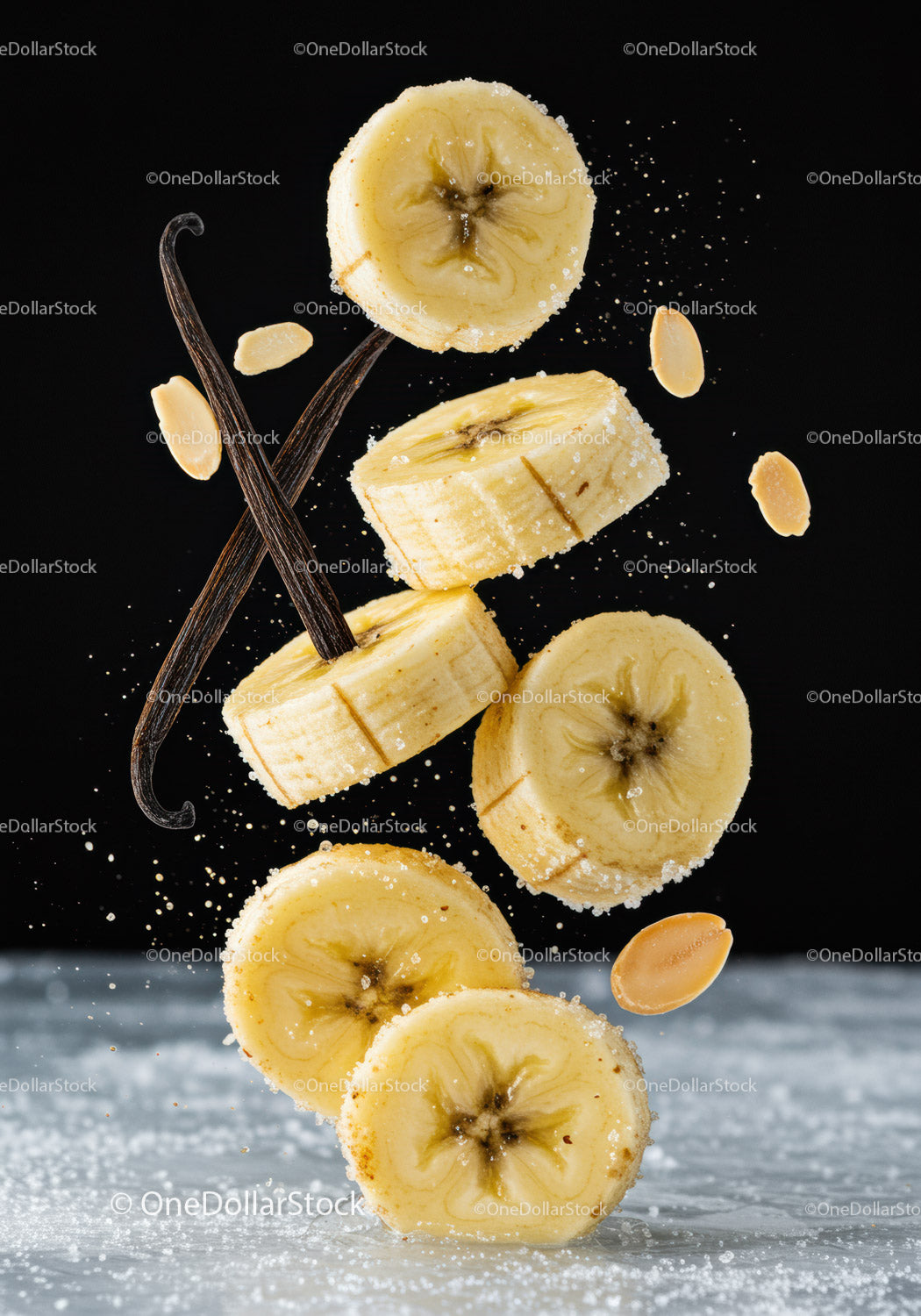 Banana slices with vanilla pods and peanut pieces in motion