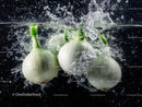 Fresh White Onions Splashing Water Underwater in Vibrant Motion