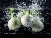 Fresh White Onions Splashing Water Underwater in Vibrant Motion