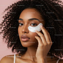 Young Woman Applying Facial Mask with Curly Hair in Studio