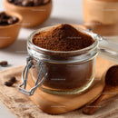 Glass Jar Filled with Fine Ground Coffee and Coffee Beans