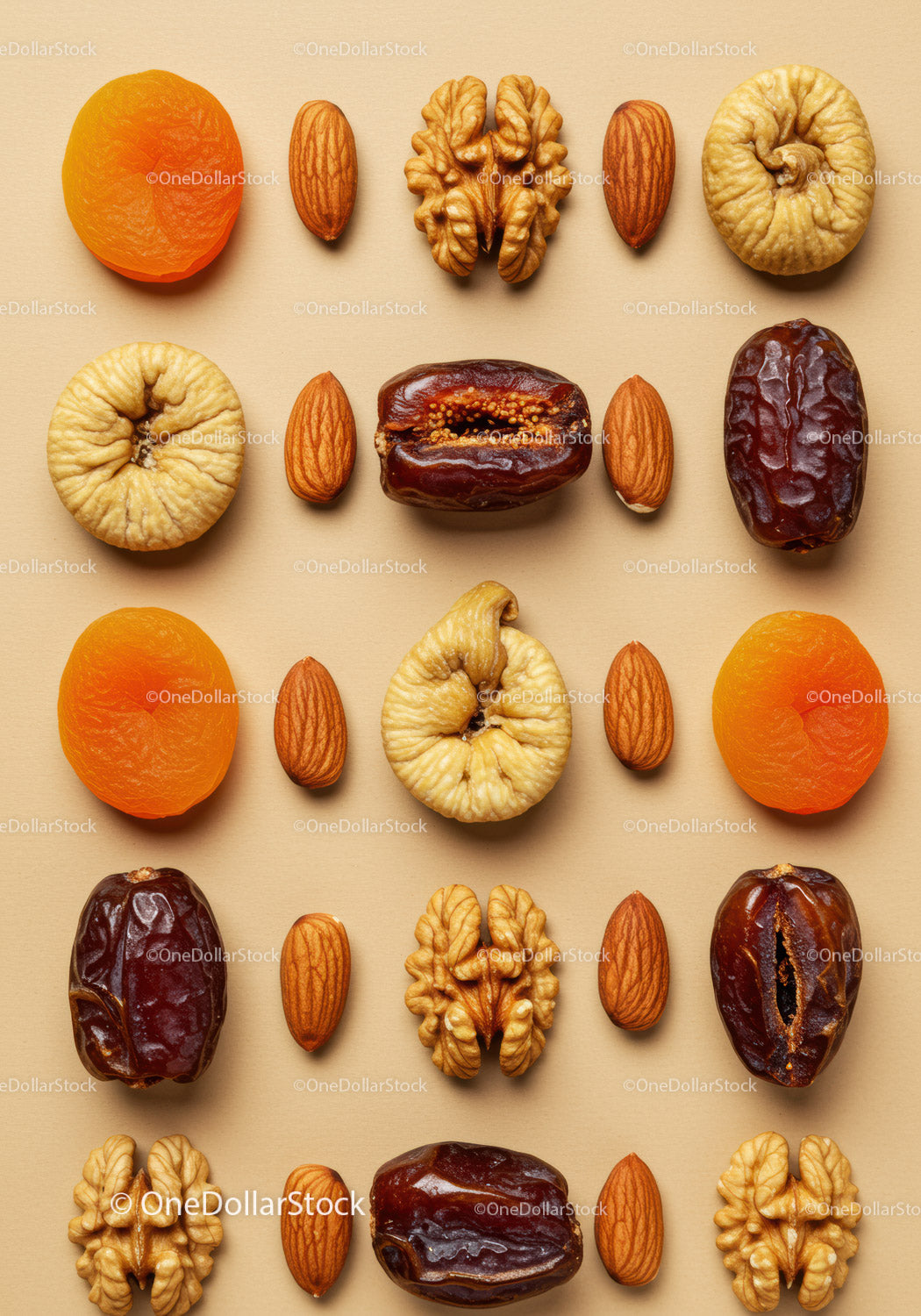 Assorted dried fruits and nuts in neat pattern