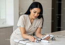 Young Woman with Skincare Tools in Modern Beauty Clinic