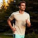 Focused young man running through sunlit forest trail