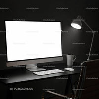 Minimalist workspace with desktop and desk lamp