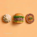 Gourmet Burger with Lettuce and Tomato Next to Grilled Steak and Dumpling