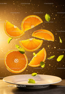 Fresh Orange Slices and Mint Leaves Floating Above Plate
