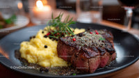 Gourmet Grilled Steak with Mashed Potatoes on Black Plate