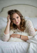 Relaxed woman resting on bed with soft pillow