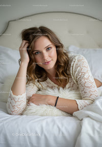 Relaxed woman resting on bed with soft pillow