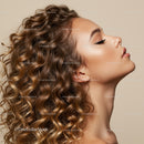 Profile of young woman with voluminous curly hair