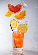 Refreshing Citrus Cocktail with Ice and Floating Fruit Slices