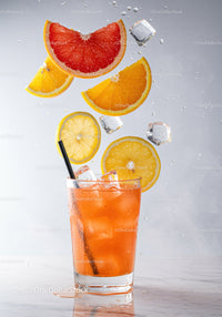 Refreshing Citrus Cocktail with Ice and Floating Fruit Slices