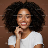 Young Woman with Curly Hair and Bright Smile in Casual Portrait
