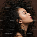 Profile of serene woman with flowing curly hair