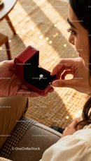 Couple Sharing Intimate Moment with Engagement Ring
