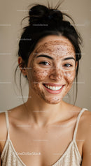 Young Woman with Freckled Skin Smiling in Casual Top