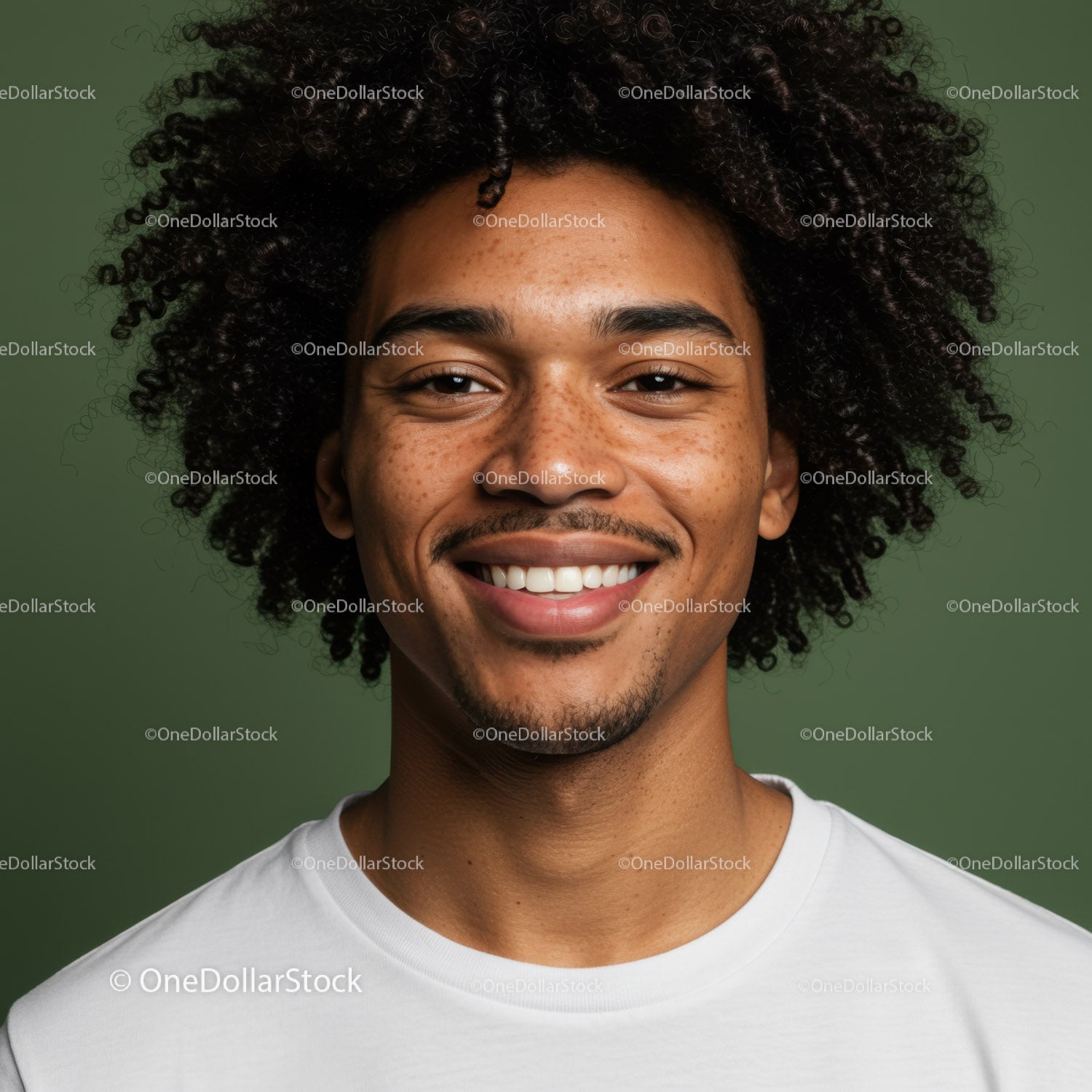 Portrait of a Smiling Man with Curly Hair in Bright Casual Style