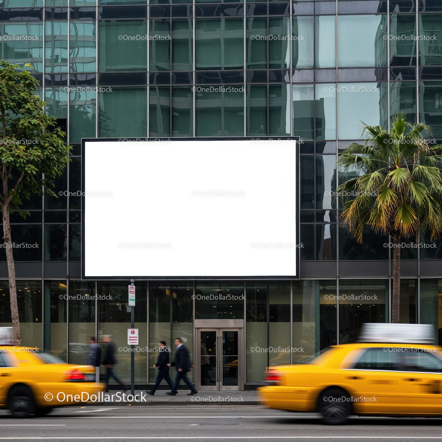 Yellow taxis pass by urban building with blank billboard