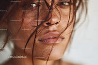Close-Up Portrait of Freckled Woman with Expressive Gaze