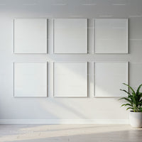 Minimalist blank white frames on light wall