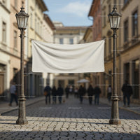Blank white banner hanging between vintage street lamps