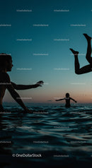 Playful Moments in the Water at Sunset