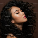 Profile of woman with natural curly hair and makeup