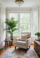 Bright Cozy Reading Corner with Large Bay Windows and Houseplant