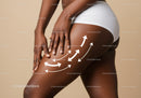 Close-Up of a Woman Applying Lotion to Thigh Emphasizing Beautiful Skin and Wellness