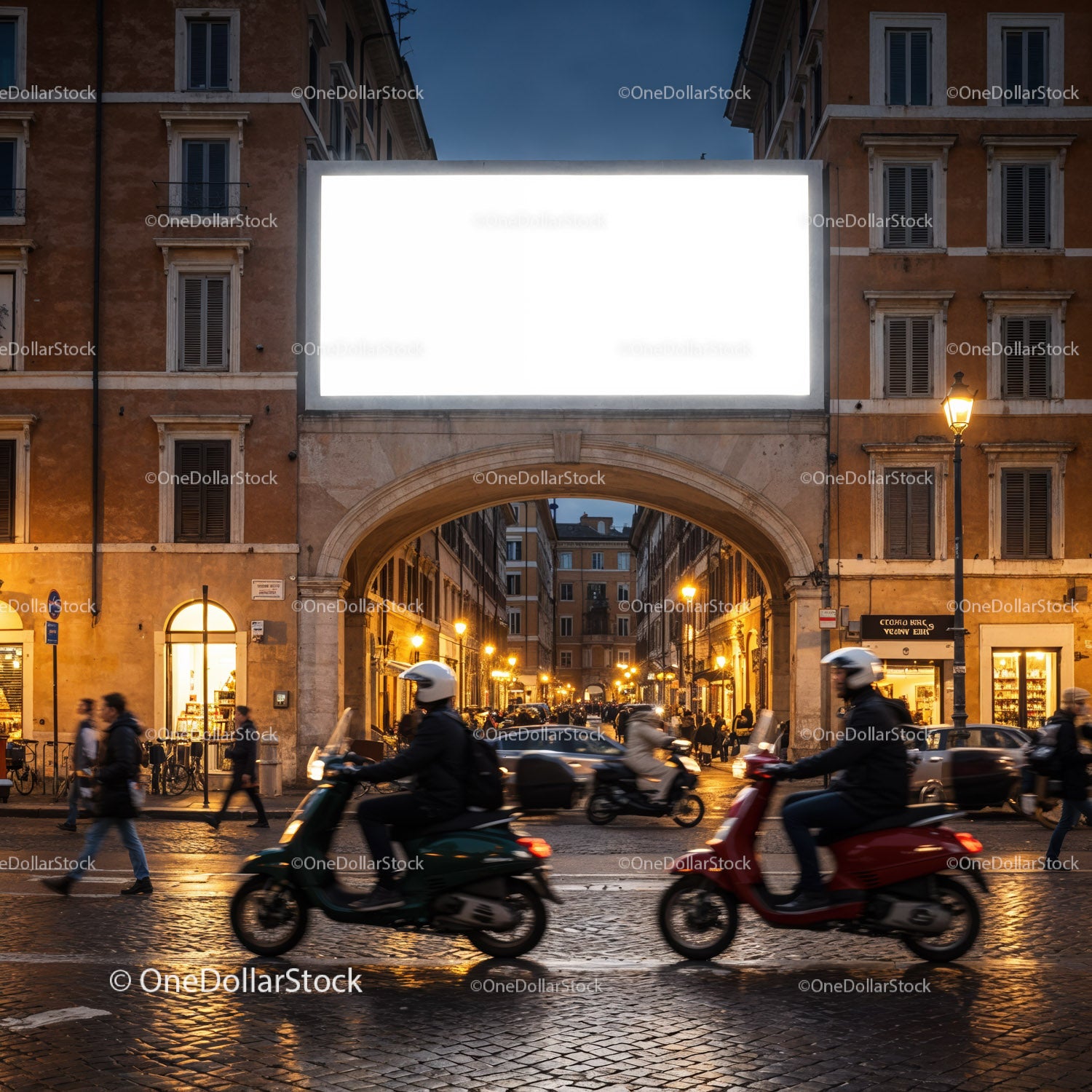 Evening scooter riders passing historic city archway