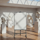 Modern art gallery with blank easel and sculptures