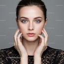 Close-Up Portrait of a Young Woman with Blue Eyes and Elegant Look