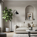 Cozy modern living room with sofa and indoor plant