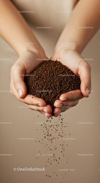 Hands gently holding falling coffee granules