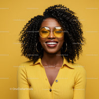 Smiling Woman with Curly Hair in Yellow Shirt and Sunglasses