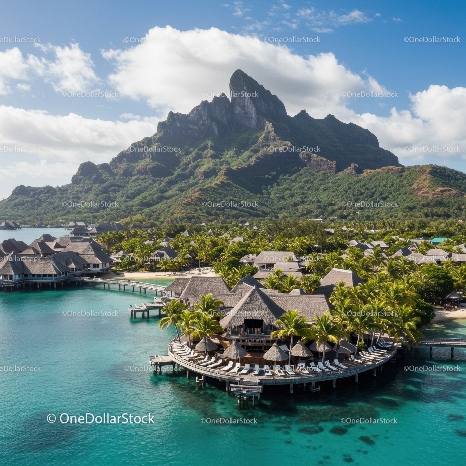 Tropical Overwater Bungalows with Mountain Background and Blue Water
