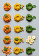 Colorful vegetable and fruit purees with fresh greens