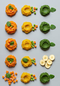Colorful vegetable and fruit purees with fresh greens