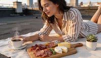 Woman Enjoying Coffee with Charcuterie and Cheese Board