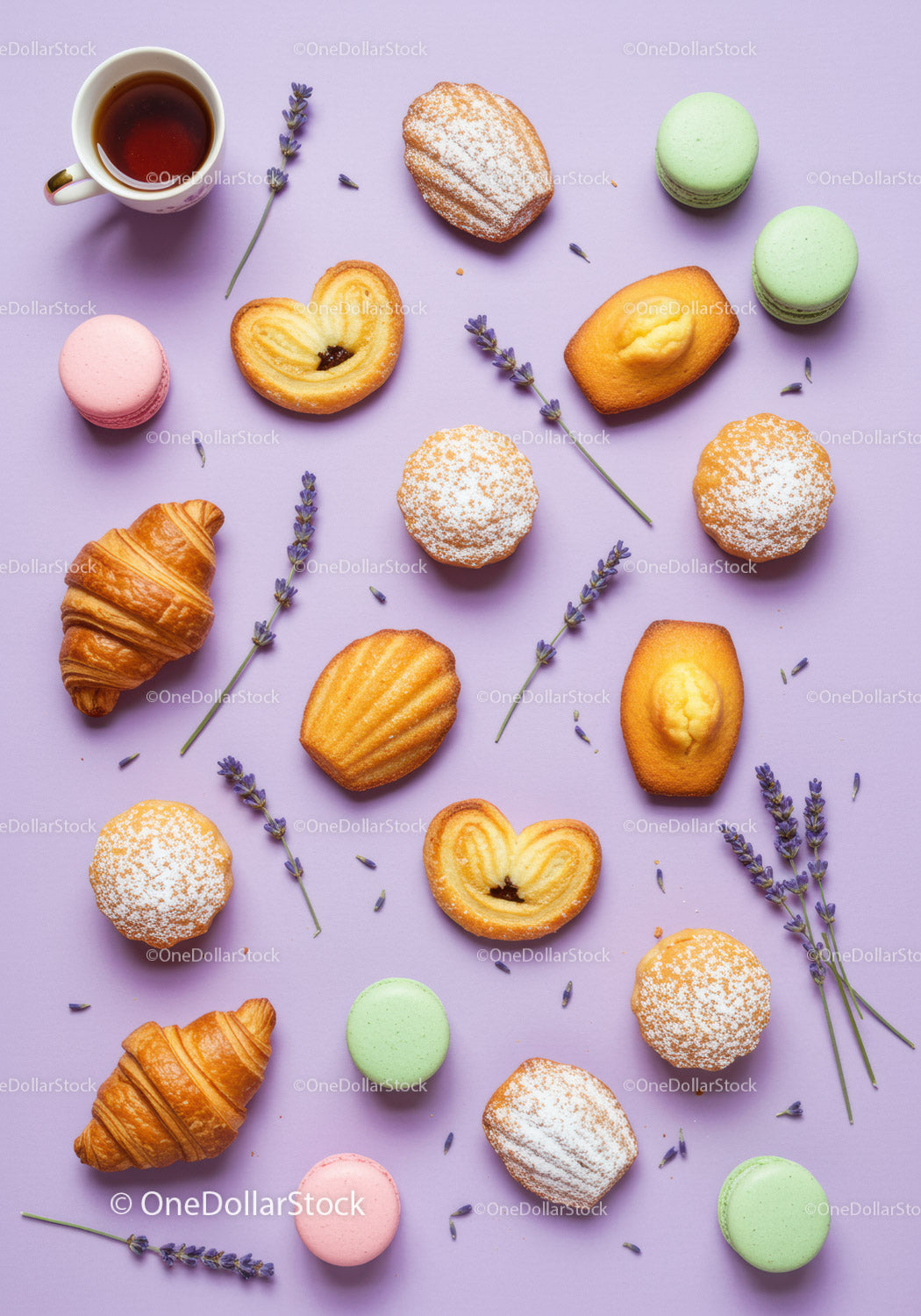 Assorted French Pastries with Lavender on Lilac Background