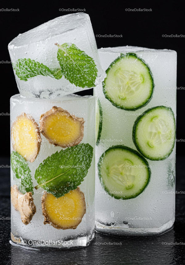 Refreshing ice cubes with mint ginger and cucumber slices