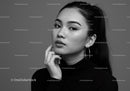 Elegant Black and White Portrait of a Woman with Hoop Earrings