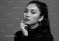 Elegant Black and White Portrait of a Woman with Hoop Earrings