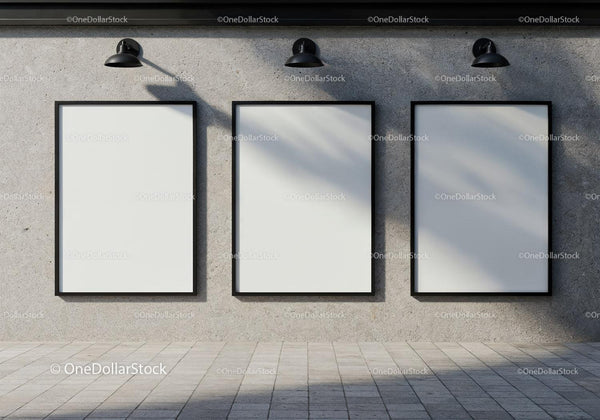 Three Blank Vertical Posters on Concrete Wall with Lamps JPG Mockup Image