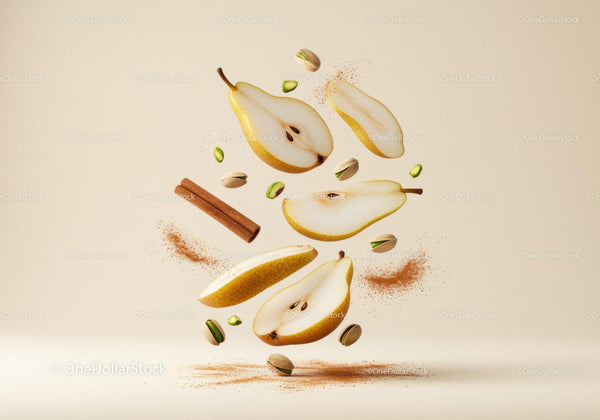 Sliced pear with cinnamon and pistachios floating