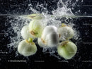 Fresh White Onions Splashing Underwater in Water Splash Scene