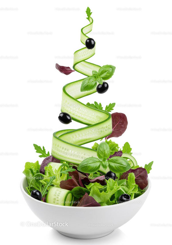 Fresh garden salad with cucumber ribbon and black olives