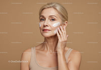 Elegant Mature Woman Applying Skin Cream for Youthful Aging