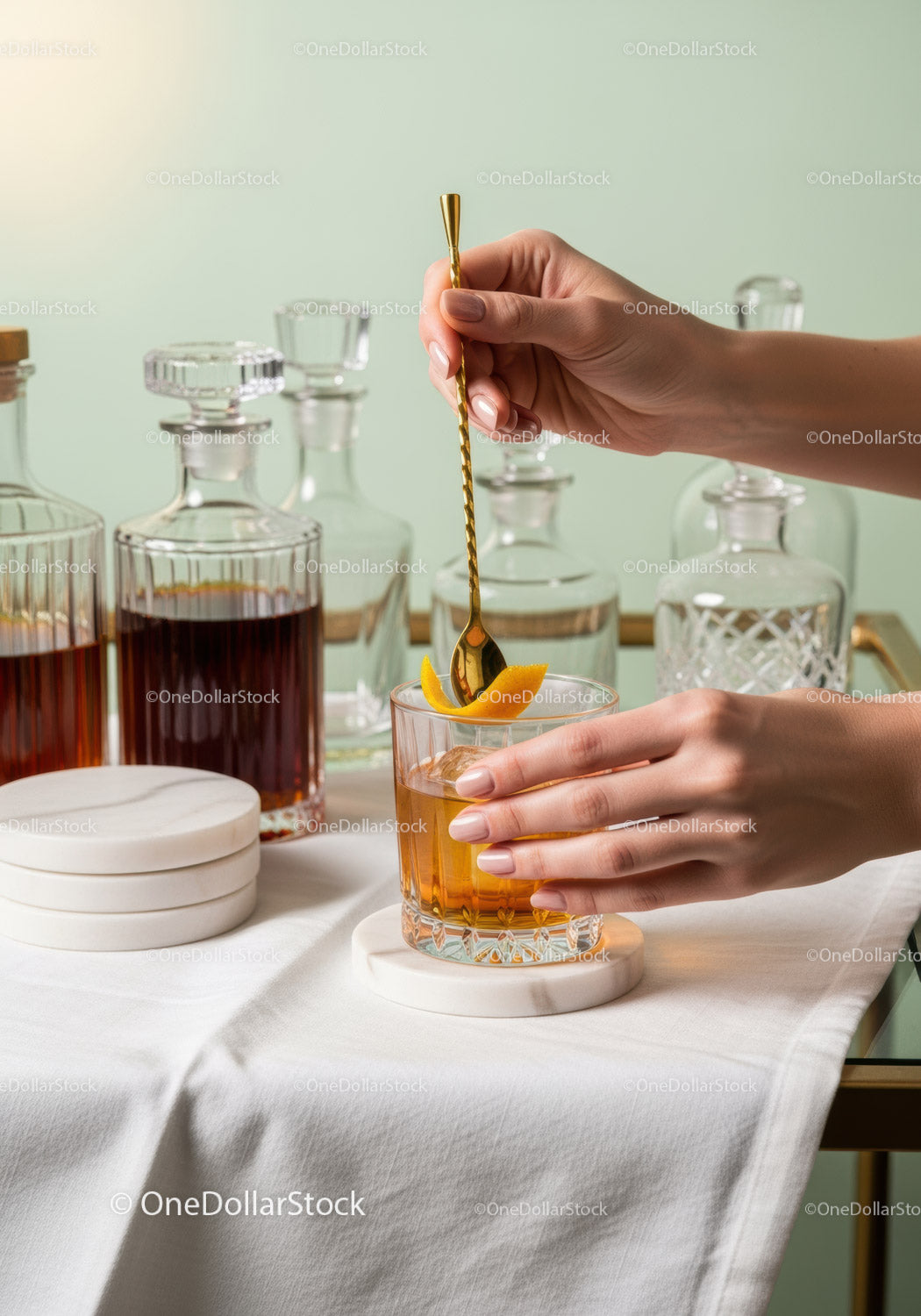Elegant Cocktail Preparation with Orange Garnish in Modern Bar Scene